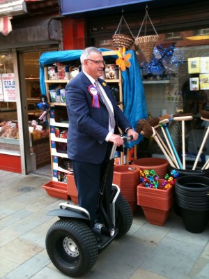 PUP's Brian Ervine on a Segway on an East Belfast pavement