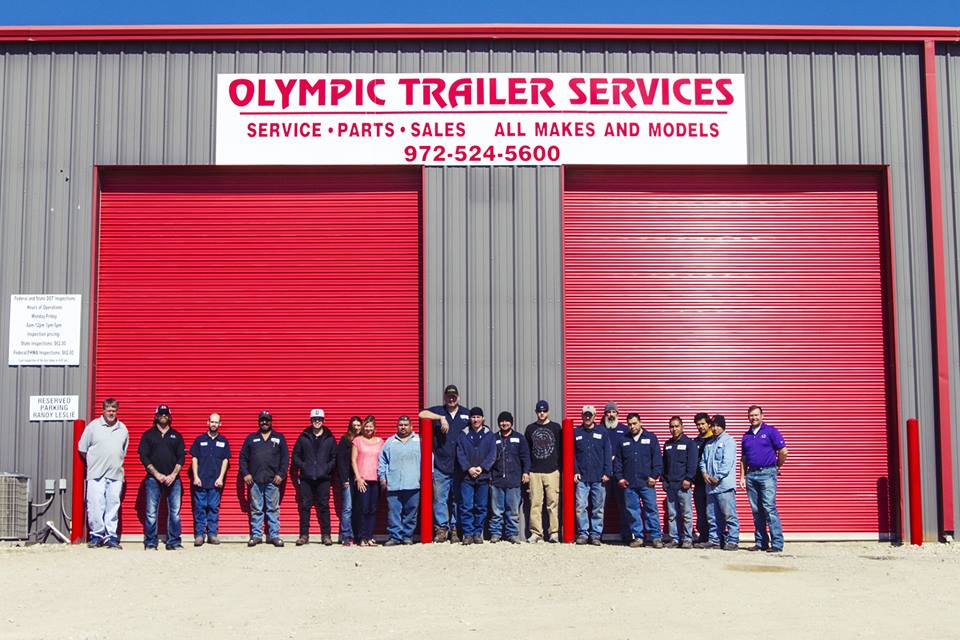 Olympic Trailer Services - sign and staff group picture