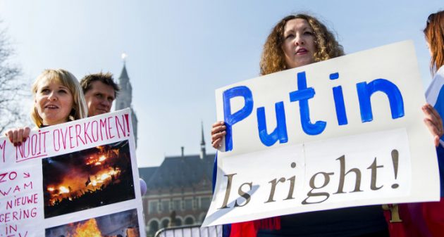 Pro-Russian supporters stage a protest asking for the self-determination of Ukraine's Crimea peninsula, in front of the Peace Palace in The Hague, The Netherlands, on March 14, 2014. (REMKO DE WAAL/AFP/Getty Images)