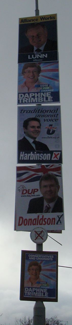 five posters, four parties, one lamppost