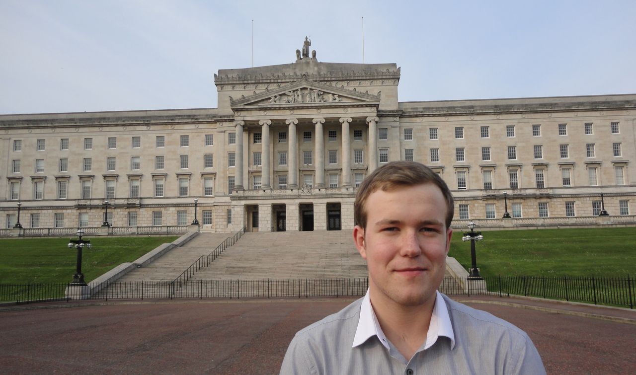 Stephen Stewart, 18 year old East Belfast independent standing in front of Parliament Buildings