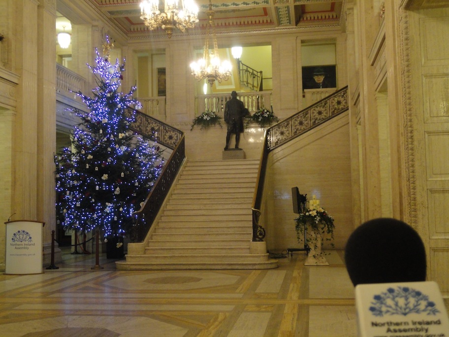 Parliament Buildings, Christmas tree with Paisley's portrait glaring down over the souls in the Great Hall