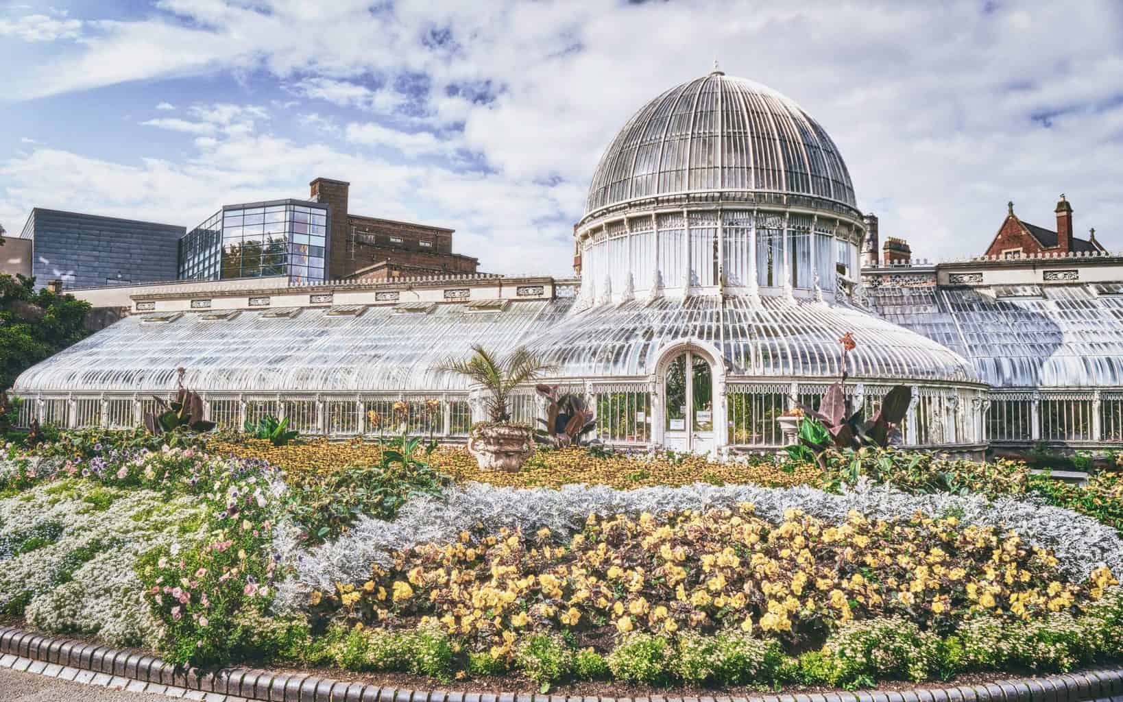 The greenhouse, adorned with a floral display, at the Botanic Gardens in the Queen's Quarter of Belfast, County Antrim (Sep., 2021).