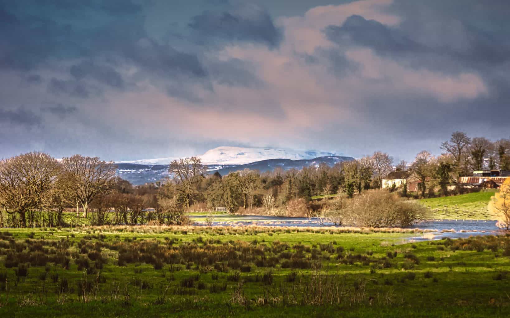 The snow-capped Cuilcagh Mountains seen from Belle Isle Estate in County Fermanagh after a late winter/early spring storm.