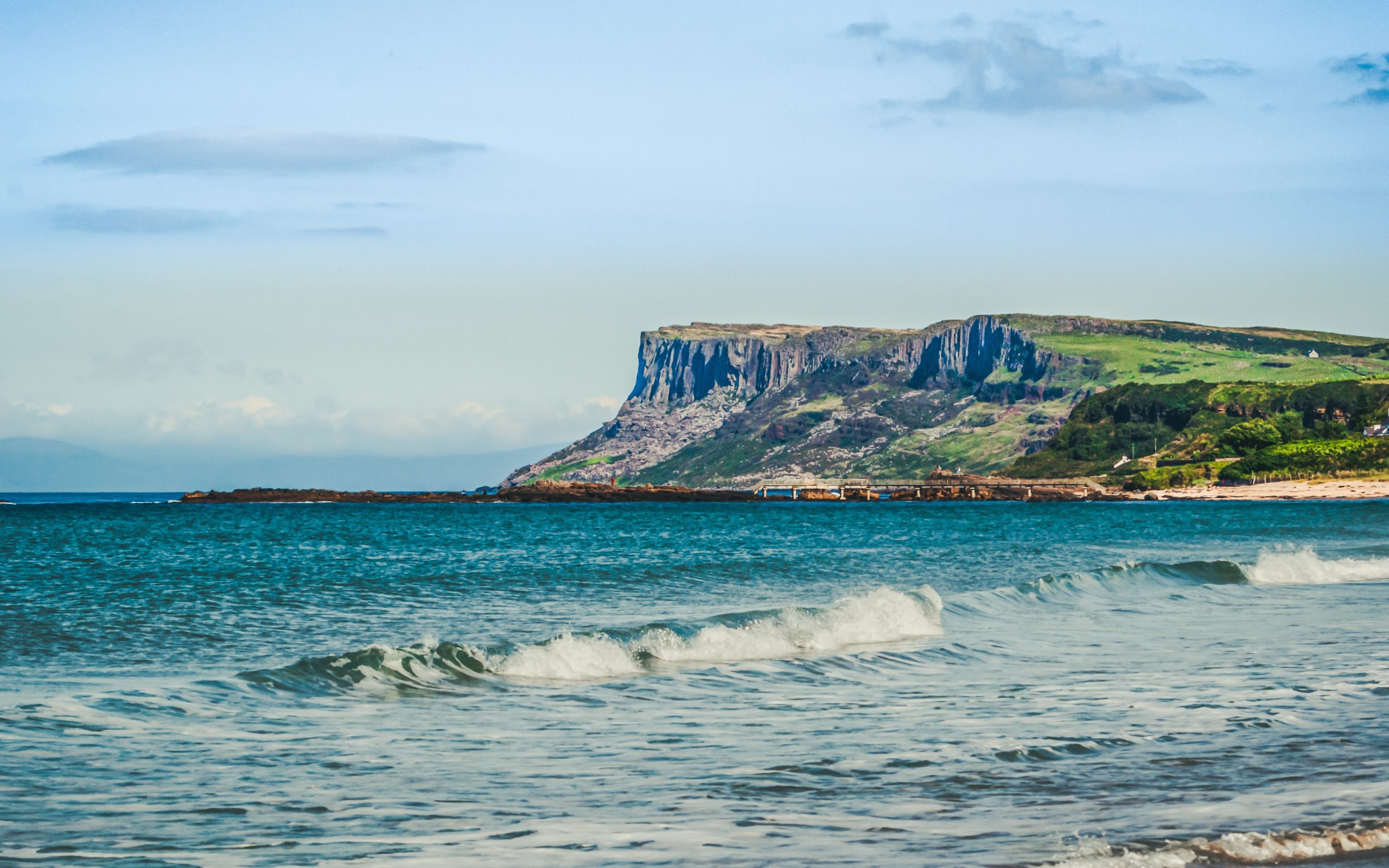 The North Coast of Northern Ireland from Ballycastle Beach in Country Antrim. In the background is the coast of Scotland which is only 13 miles away at this point.