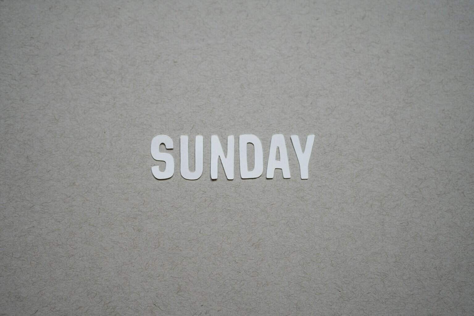 the word sunday written in cut out letters