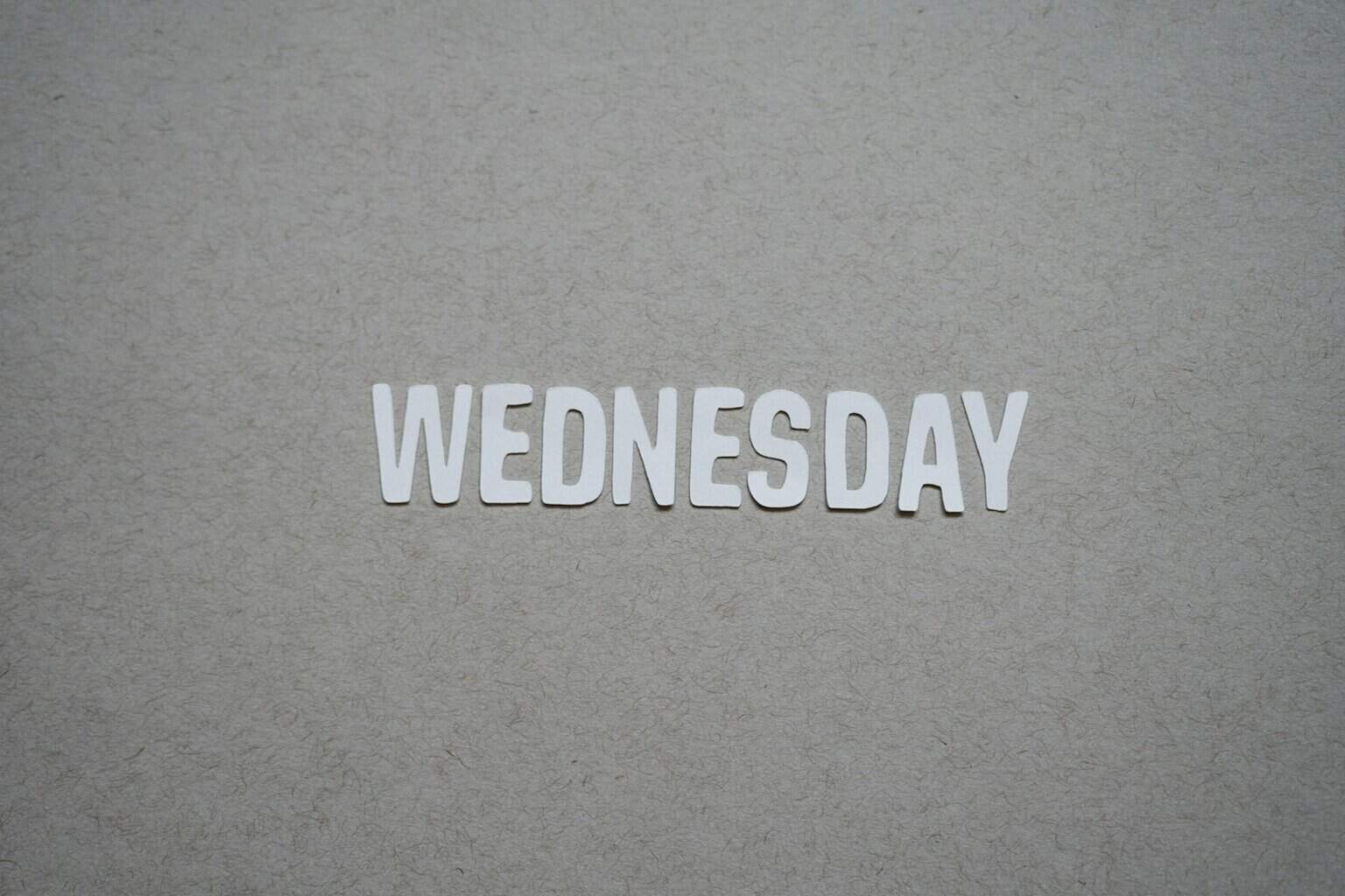 the word wednesday written in cut out letters