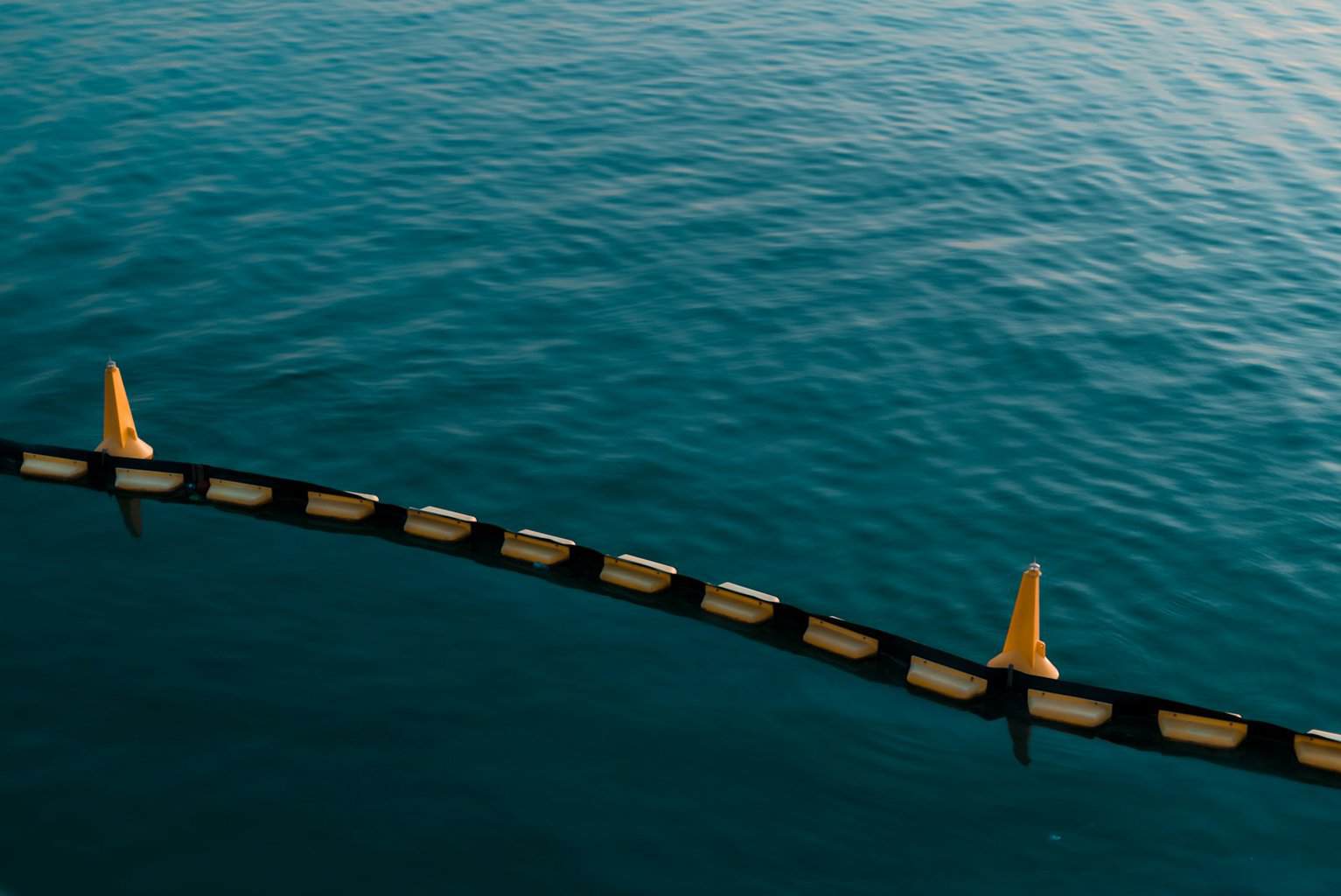 black and white boat on blue sea during daytime
