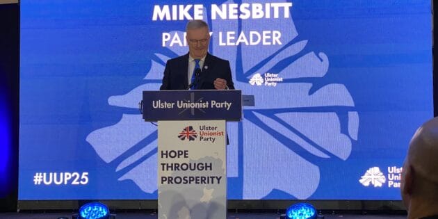 Mike Nesbitt standing on stage at UUP 2025 conference