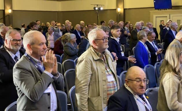 Audience standing to applaud at UUP 2025 conference
