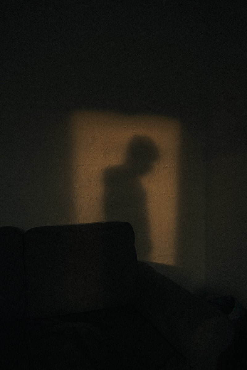 black sofa chair near white wall